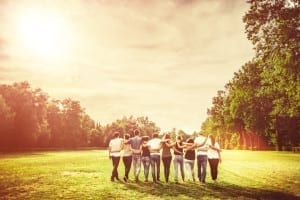 Group of Teenage Friends in the Park at Sunset