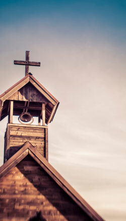 Rural old church steeple cross and bell tower